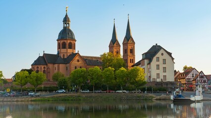Beautiful shot of the cathedral in Seligenstadt, Hesse, Germany on a daylight over the river Main - obrazy, fototapety, plakaty
