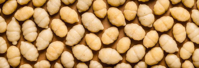 Close-up of peanuts on a wooden surface, AI-generated.