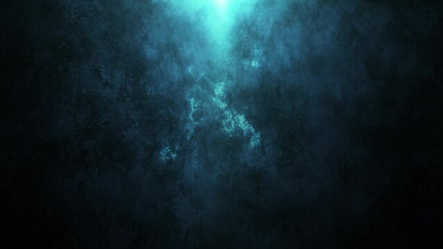 Abstract movement of blue fire. The blue fire flame glows and burns. Abstract flame on a dark background. 4k animation.