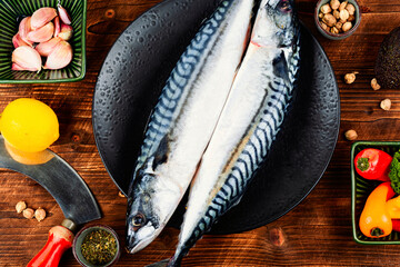 Raw mackerel fish on wooden background. - 780409071