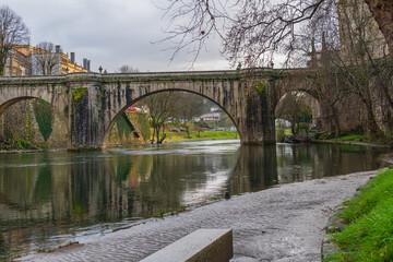 Fototapeta premium The Ponte de Sao Goncalo Bridge, Amarante Portugal. The iconic bridge is located on the Tamrga river at Amarante Portugal.