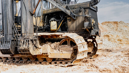 Pile driving machine. Diesel hammer pile driving machine working on construction site. Preparation of the pile foundation for the construction of the building. Close-up.