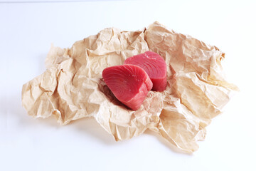 Piece of tuna on white background. natural omega. Isolated object.
