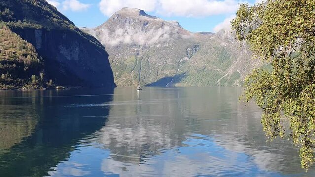 Scenic view of rocky mountains and a lake, geirangerfjord, Norway