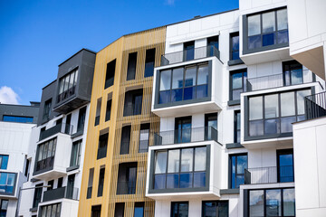 Obraz premium A modern, environmentally friendly, landscaped area with a wide avenue and green areas and modern residential buildings