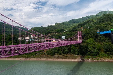 Scenic view of the Luofu Bridge above a river surrounded by green mountains in Taiwan