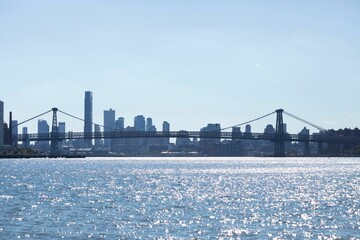 View of the Brooklyn bridge and Manhattan from the water in New York City, United States.