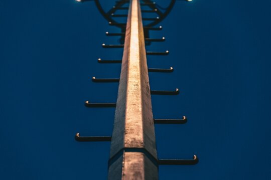 Low angle view of light pole at night