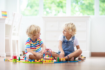 Kids play wooden railway. Child with toy train. - 780421878