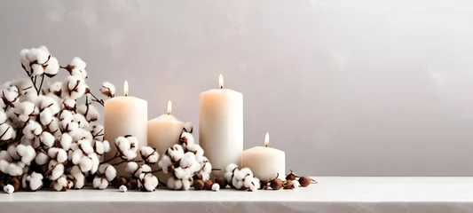 Foto op Plexiglas Two white burning candles on a concrete tray and warm winter scarfHome decoration with candle and flowers over white wall Interior design concept Close up,Copy spa,Romania generative by ai.. © Bushra