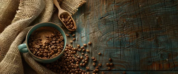 Foto op Plexiglas A cup of coffee and beans on the table with rustic background, with burlap cloth and wooden spoon for spilling coffee bean, top view © Moon Art Pic