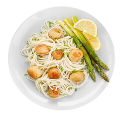 Delicious scallop pasta with asparagus, green onion and lemon isolated on white, top view