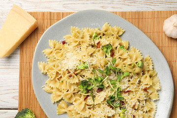 Vegetarian meal. Tasty pasta with fresh vegetables and cheese on white wooden table, top view
