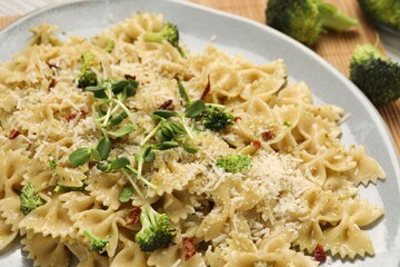 Vegetarian meal. Tasty pasta with vegetables and cheese on plate, closeup