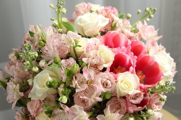 Beautiful bouquet of fresh flowers in room, closeup