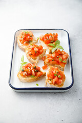 Traditional tomato bruschetta with greens