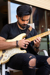 Rock guitarist playing with an electric guitar