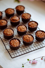fresh muffins cooling on a baking rack, carrot muffins