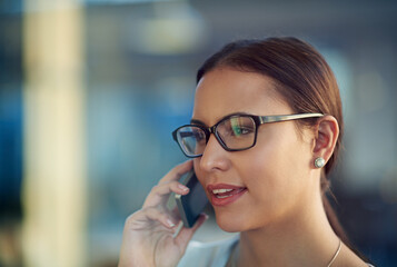 Woman, talking and phone call in workplace for business with communication, glasses and graphic design. Office, agency job and mobile in hand for speaking conversation, internet and creative company