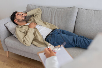 Fototapeta premium Man lying on couch during a therapy session