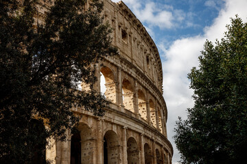 Famous arches on the Roman Colosseum facade. Coliseum at springtime.
