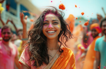 Young Indian woman among colorful powder - 780452658