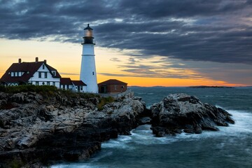 Fototapeta na wymiar Scenic view of the Portland Head Lighthouse with a beautiful sunset visible in the background