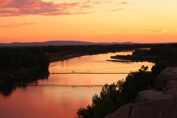 Mesmerizing sunset view over the river and a bridge