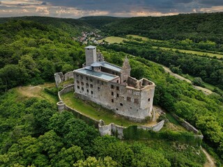 Aerial view of the Burgruine Konigstein castle in the green forest