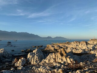 Scenic shot of a rocky coastline on New Zealand under the blue sky