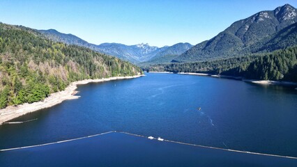 Beautiful view of Capilano Lake near the mountains in British Columbia, Canada
