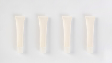 Plastic white tube for cream or lotion. Skin care or sunscreen cosmetic on white background.