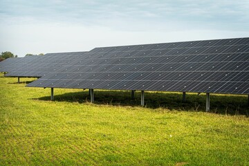 Solar system panels in the large photovoltaic power plant in the green field