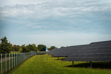 Solar system panels in the large photovoltaic power plant in the green field