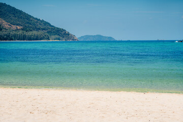 Beach and clear blue water in summer and vacation
