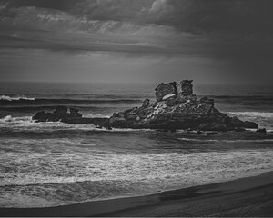 Beautiful grayscale view of rocks formation at the coastline
