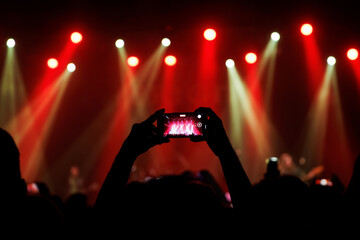 Video recording of the concert on a mobile phone or a smartphone