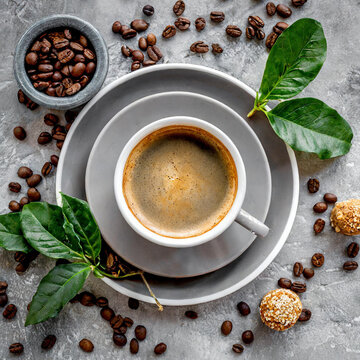 Cappuccino in cup on grey background