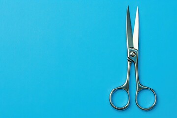 Surgical scissor on blue - obrazy, fototapety, plakaty