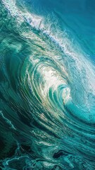 Sunlight breaks through the surface of an iridescent turquoise ocean wave