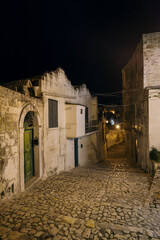Matera street by night, Italy - 780487001