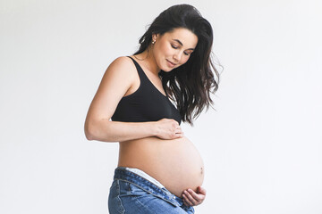 Pregnant woman in black top and jeans