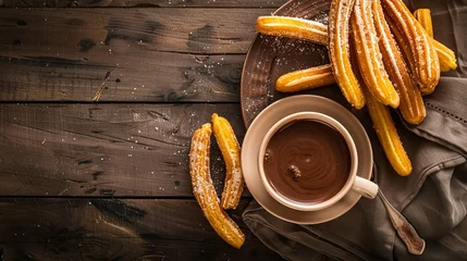 Rollo Gourmet Spanish churros served with hot chocolate top view © Naila
