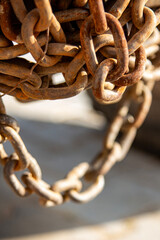 Rusty chain on the side of a truck. Rusty chain close-up. Selective focus. Shallow depth of field.