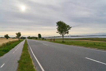 Empty asphalt street with separated bike lane in Sweden - obrazy, fototapety, plakaty