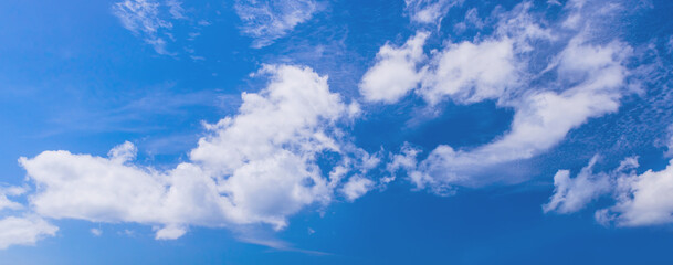 Blue sky with white clouds on a daytime. Natural panoramic background  photo