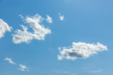 Bright blue sky with white clouds. Natural background photo - obrazy, fototapety, plakaty