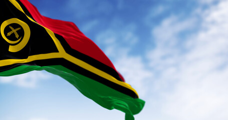 National flag of Vanuatu waving in the wind on a clear day