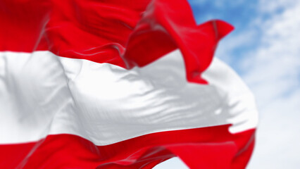 Close-up of the national flag of Austria waving on a clear day. - 780509067
