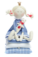 Sewing doll The Princess and the Pea in blue dress isolated on white,  fairy tale, toy or interior decoration concept